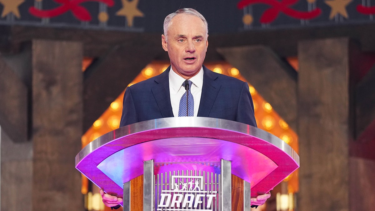 Rob Manfred speaks at a podium