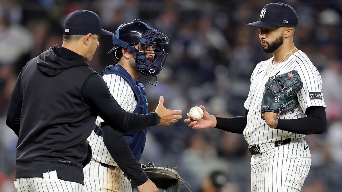 Devin Williams and Aaron Boone