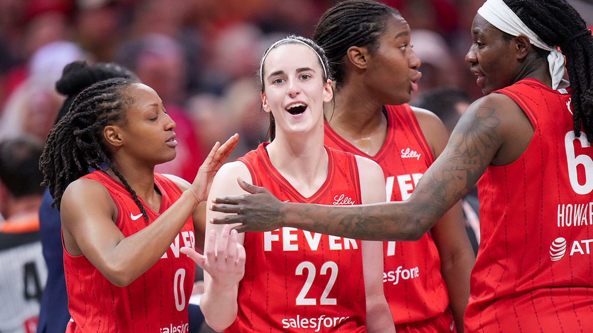 Caitlin Clark and Fever teammates