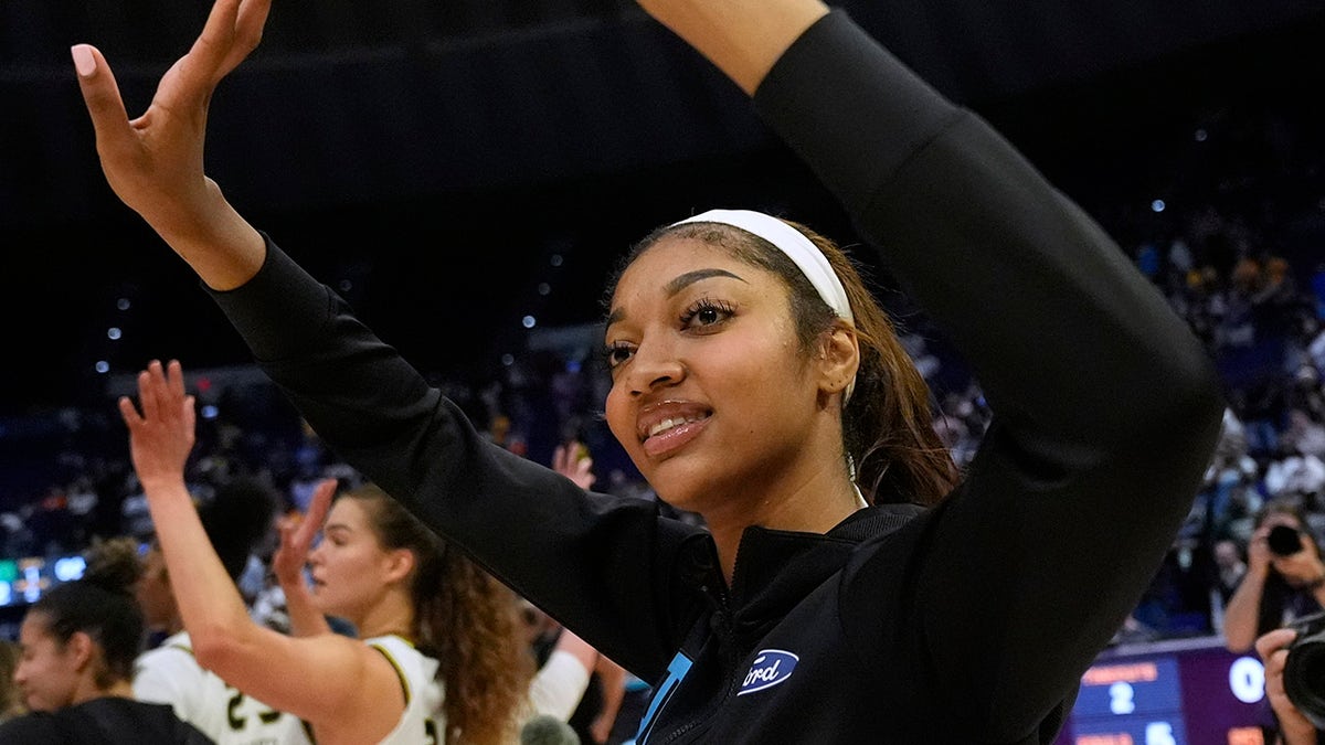 Angel Reese waves to the crowd