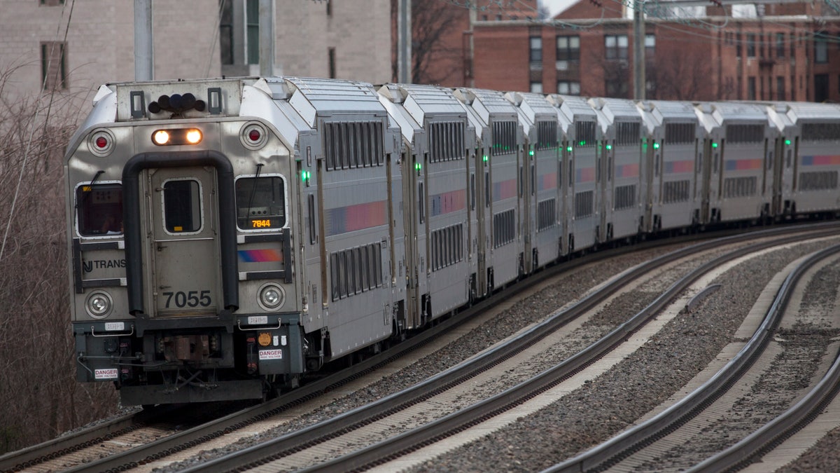 A New Jersey Transit train from Trenton to New York travels through the S-curve south of the station in Elizabeth, N.J., along Amtrak's Northeast Corridor on Saturday, March 12, 2016. (AP Photo/David Boe)
