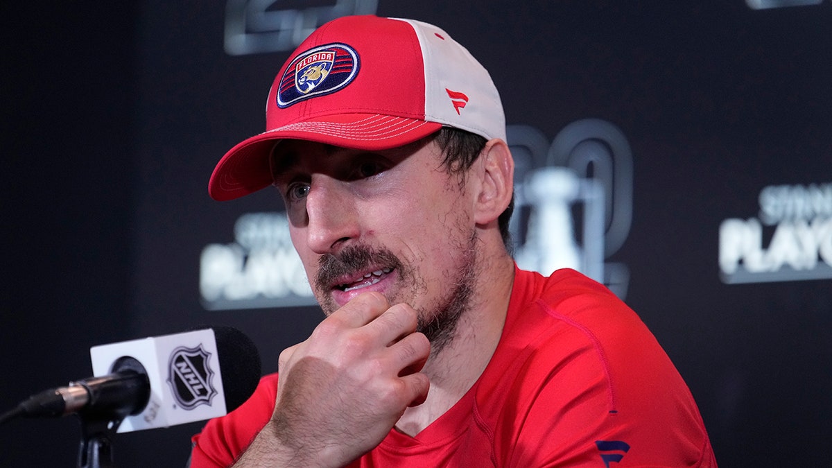 Brad Marchand talks to the press