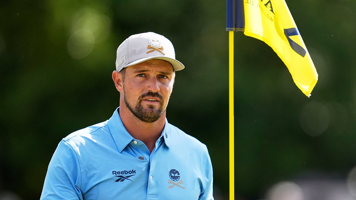 Bryson DeChambeau practices