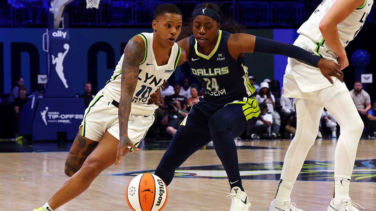 Courtney Williams dribbles