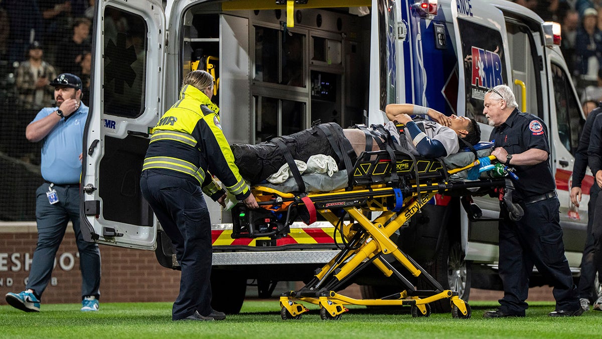 Oswaldo Cabrera on a stretcher