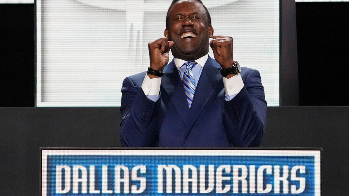 Rolando Blackman celebrates winning the lottery