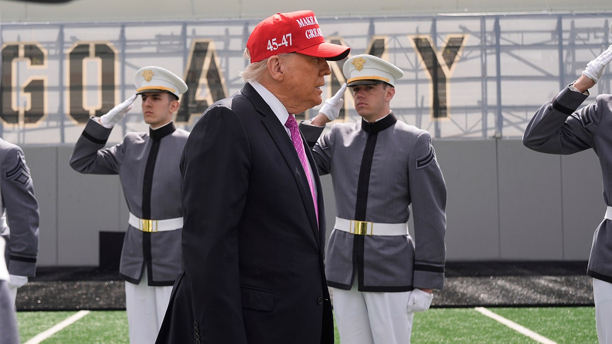 Trump walking on army field