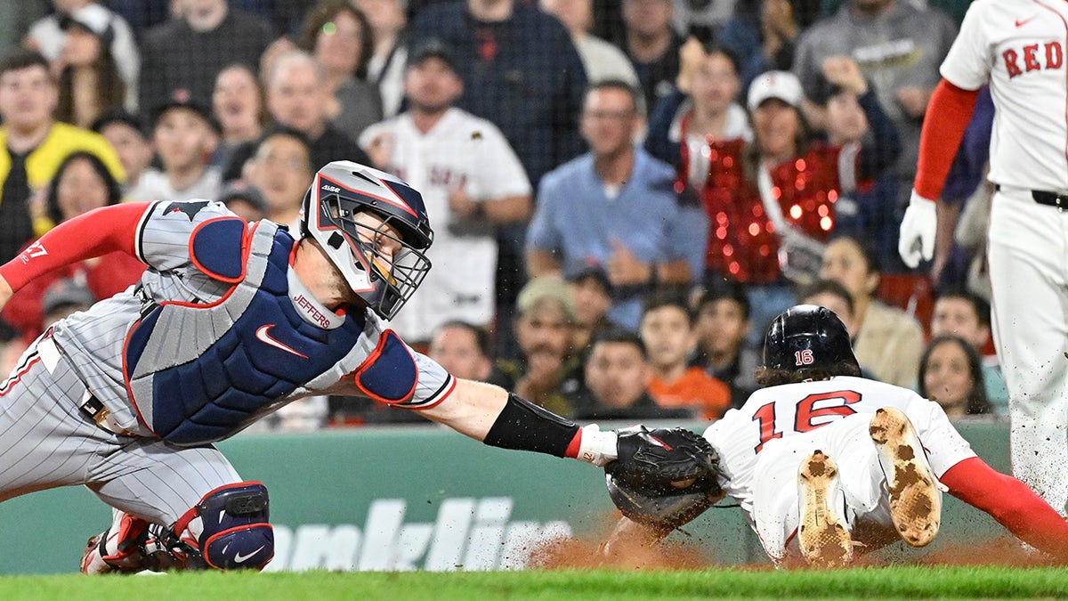 Jarren Duran sliding into home