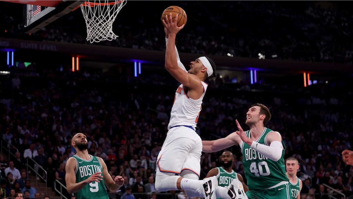 New York Knicks guard Josh Hart (3) drives to the basket against Boston Celtics guards Derrick White (9) and Jaylen Brown (7) and center Luke Kornet (40) during the second quarter of game six in the second round of the 2025 NBA Playoffs at Madison Square Garden. 