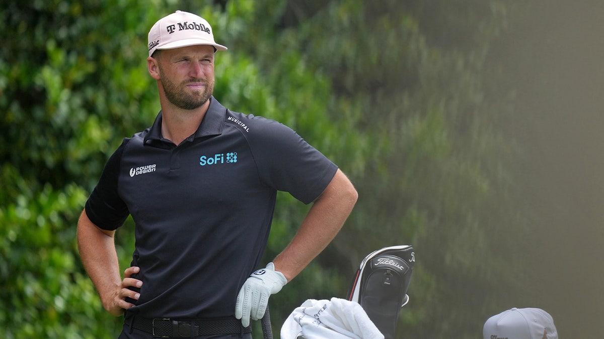 Wyndham Clark looks on