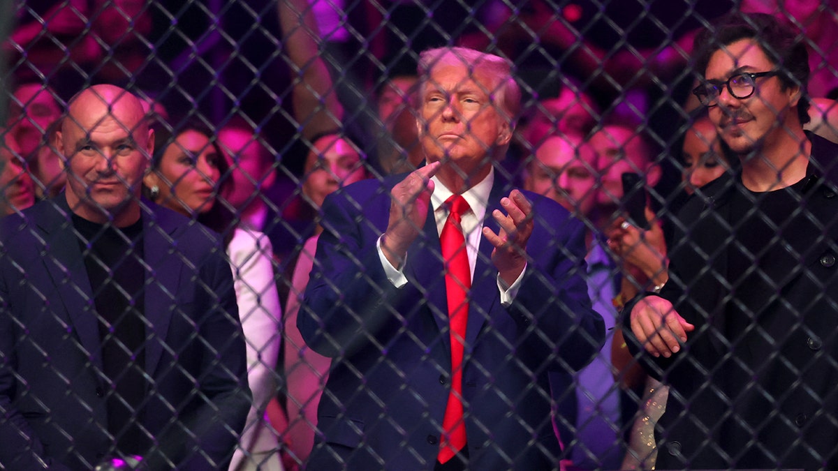 UFC CEO Dana White, left, and President Donald Trump look on before a bantamweight title fight during UFC 316 at Prudential Center.