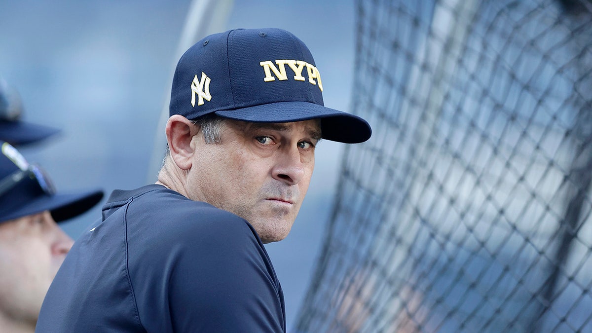 Aaron Boone watching batting practice