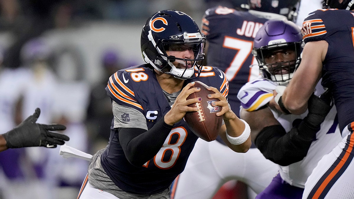 Caleb Williams looks to throw