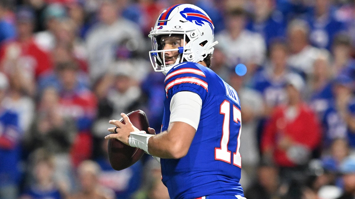 Josh Allen looks to pass