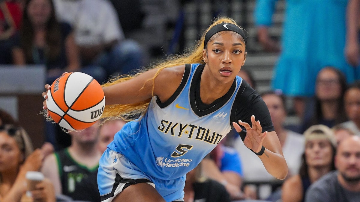 Chicago Sky forward Angel Reese (5) dribbles against the Minnesota Lynx in the first quarter at Target Center.