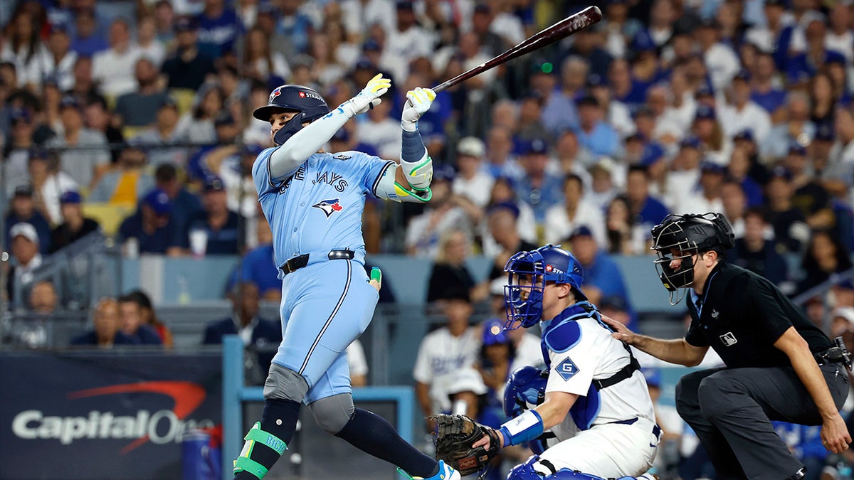 Bo Bichette swings at home plate