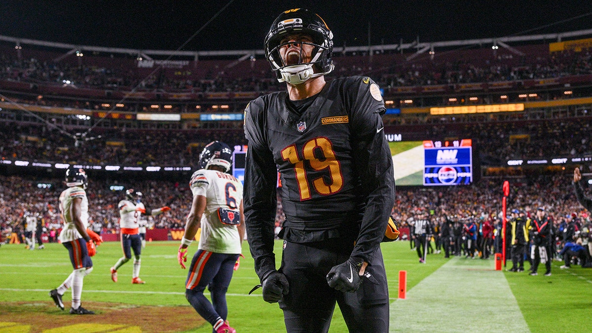 Chris Moore celebrates a touchdown